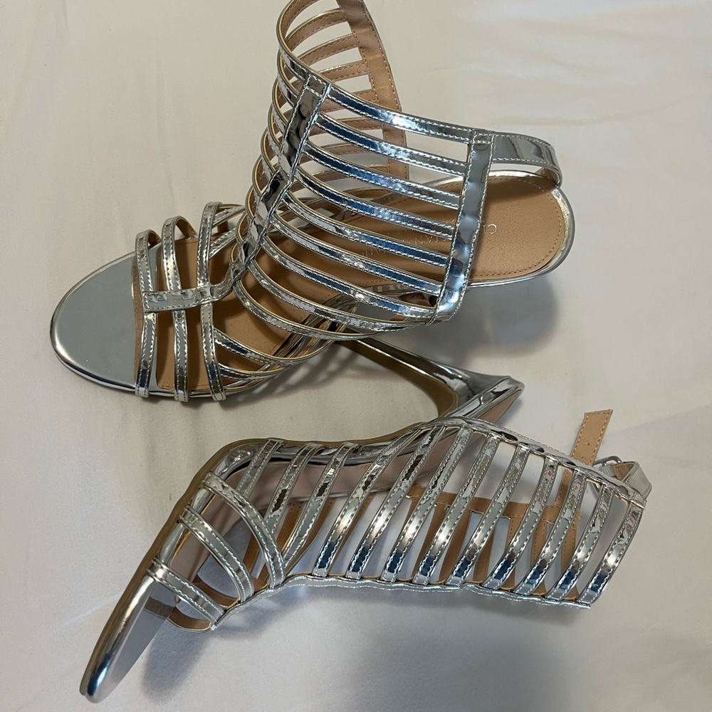 It’s your time to shine!  These silver heels will will make any outfit sparkle!